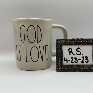 Rae Dunn “God is Love” mug with blue on the inside.
